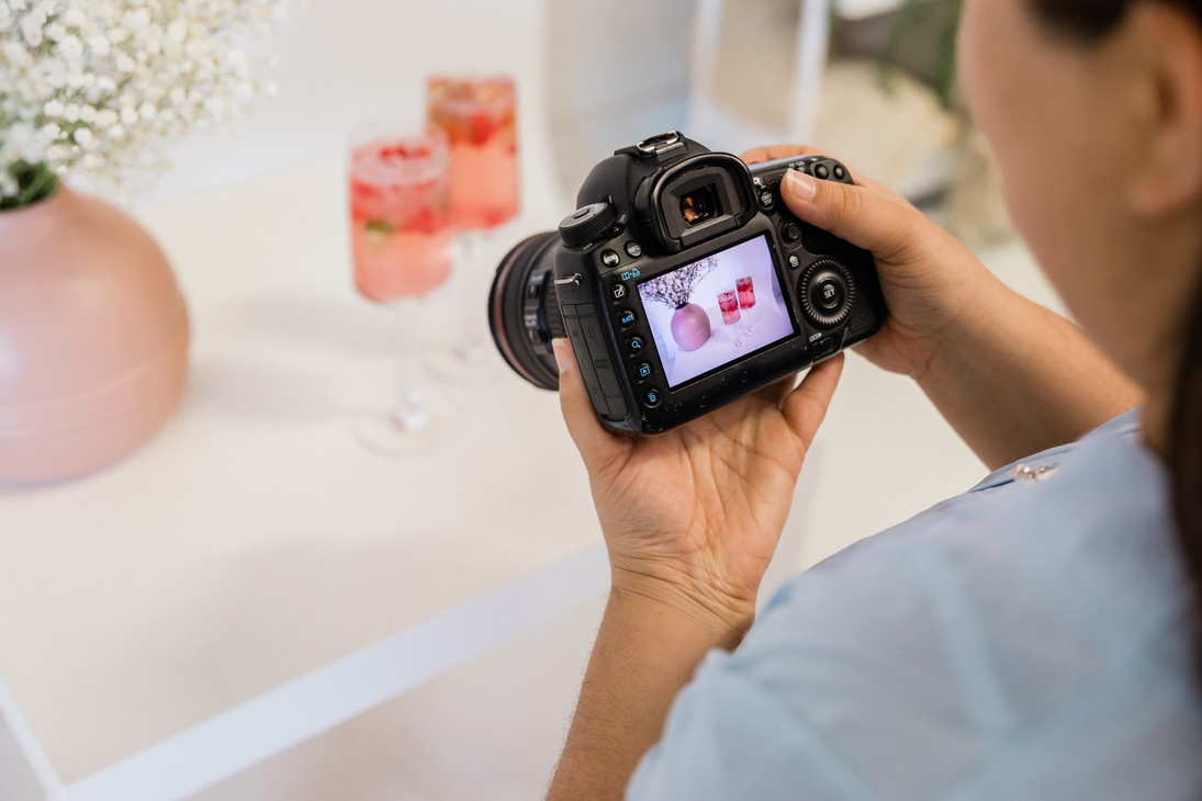 Woman Taking Photos of Cocktails